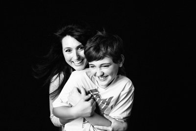 Laughing Mother Hugging Her Pre-Teen Son