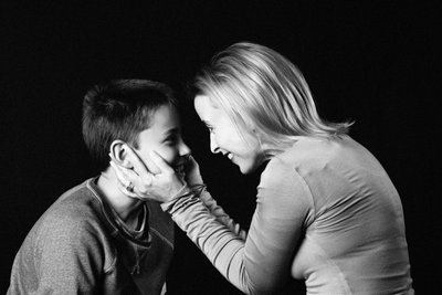 Mother Holding Son’s Face in Gentle Connection