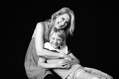 Laughing Mum and Son in Studio Hug