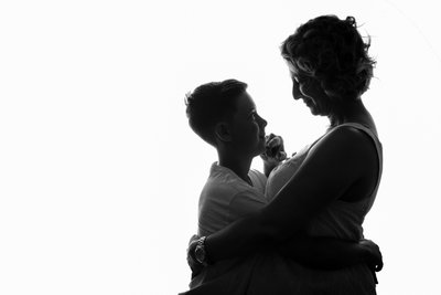 Silhouette of Mother Holding Her Son