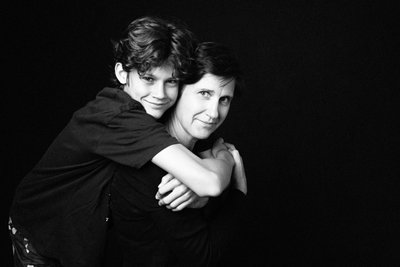 Mother Piggybacking Her Teen Son