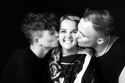 Mum Beaming Between Kisses