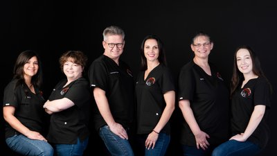 Medical Team Portrait in Branded Black Shirts and Jeans