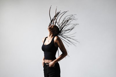Dynamic Studio Portrait with Braids in Motion