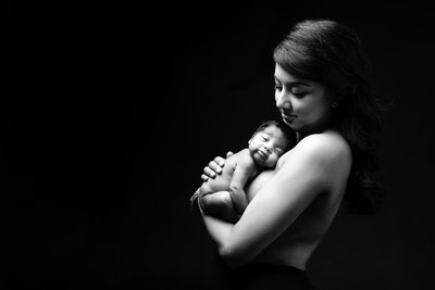 Mother’s Tender Newborn Portrait