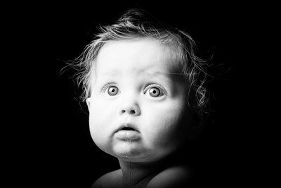 Wide-eyed black-and-white baby portrait in Johannesburg