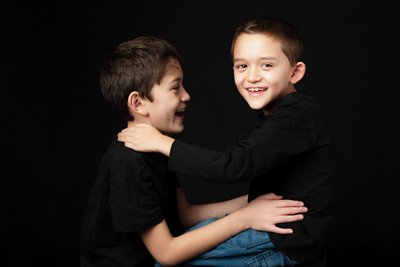 A portrait full of movement and affection, celebrating the spirited connection that exists so naturally between brothers.