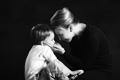 A quiet touch between mother and son
