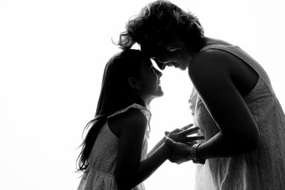 Mother and daughter in silhouette