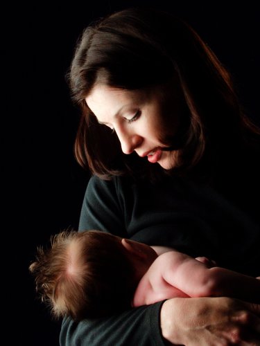 Newborn Held in Mother's Loving Gaze