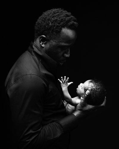 Father’s Whisper: Tender Newborn Connection