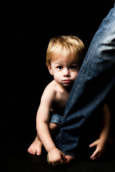 Boy Holding Fathers Ankle