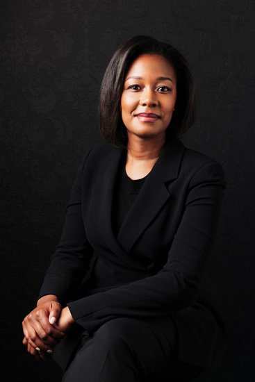 Confident Businesswoman in Black Suit Portrait