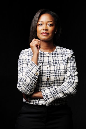 Elegant Businesswoman in Plaid Jacket Portrait