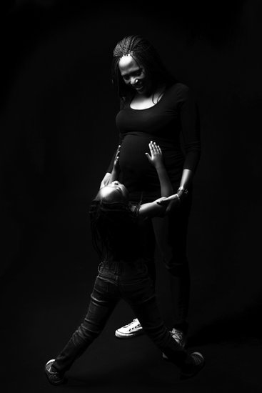 Daughter Admiring Mother's Pregnant Silhouette