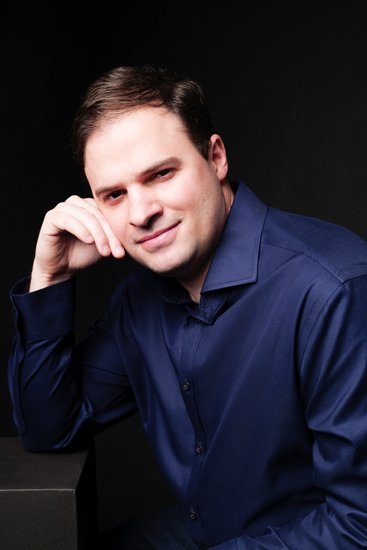 Confident Man in Navy Shirt Studio Portrait