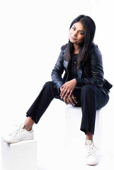 Modern Portrait of Woman in Leather Jacket and Sneakers