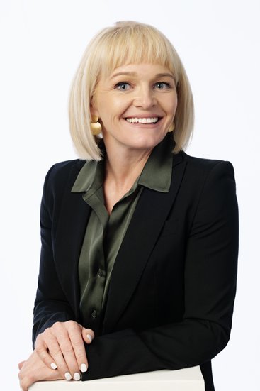 Executive headshot of a woman on white