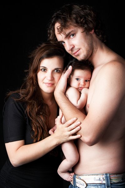 Dad Holding Newborn To His Chest