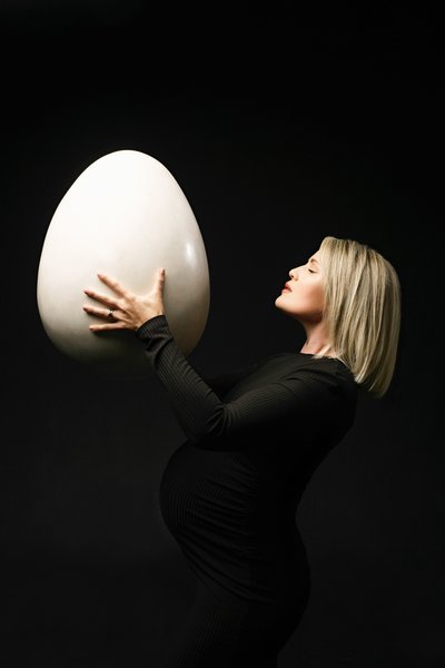 Creative Maternity Portrait with Symbolic Egg