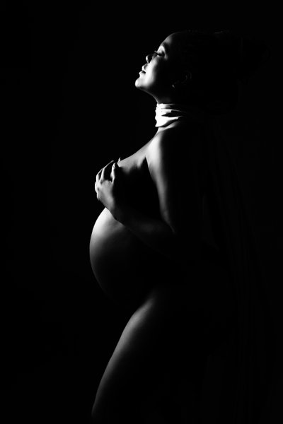 Empowering Black-and-White Maternity Portrait