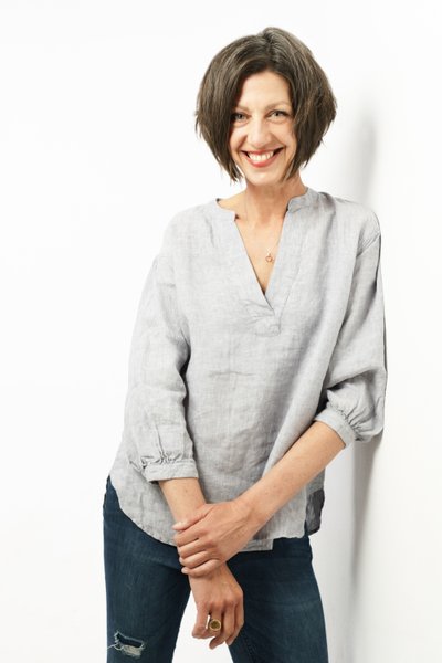 Casual Portrait of a Woman Against White Backdrop