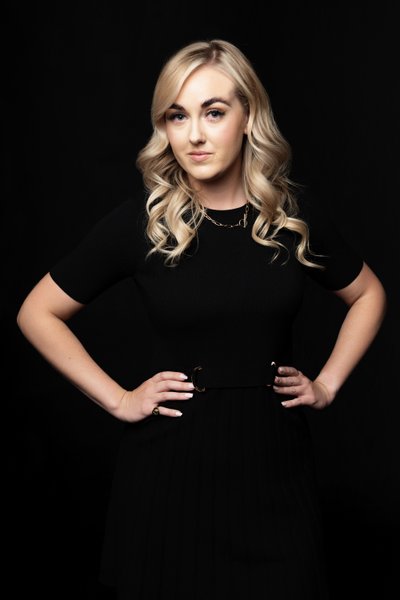 Elegant Portrait of a Blonde Woman in Black Dress