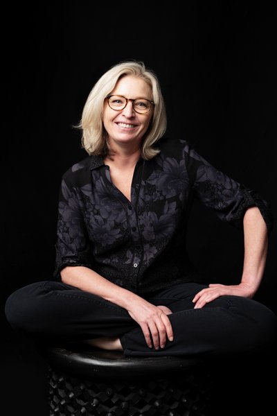 Relaxed Portrait of a Woman in Black Attire