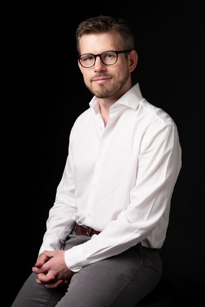 Professional Portrait of a Man in an Open White Shirt