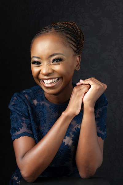 Radiant Portrait of a Woman in Elegant Navy Attire