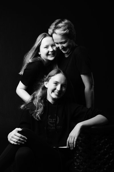 Joyful Mother and Daughters Black-and-White Portrait