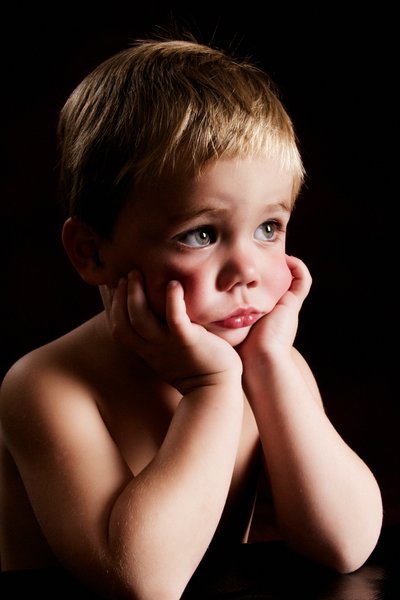 Reflective Moment: Award-Winning Young Boy Portrait 