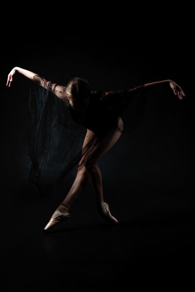 Enigmatic Ballerina in Flowing Elegance