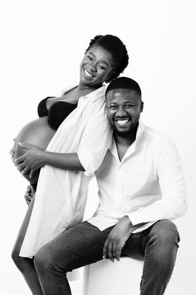 Couple's Joyful Maternity Studio Portrait in B&W