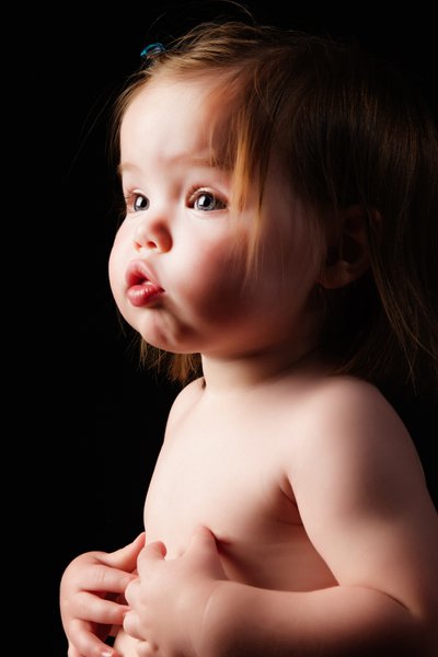 Pensive Beauty: Toddler’s Thoughtful Gaze