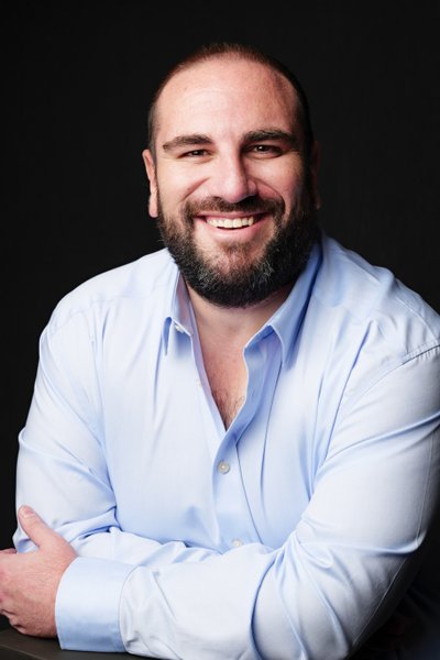 Confident Businessman in Light Blue Shirt