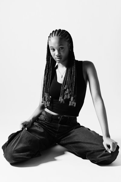 Monochrome Studio Portrait in Black Tank Top and Jeans