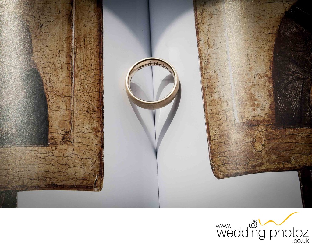 wedding ring band on book showing love symbol