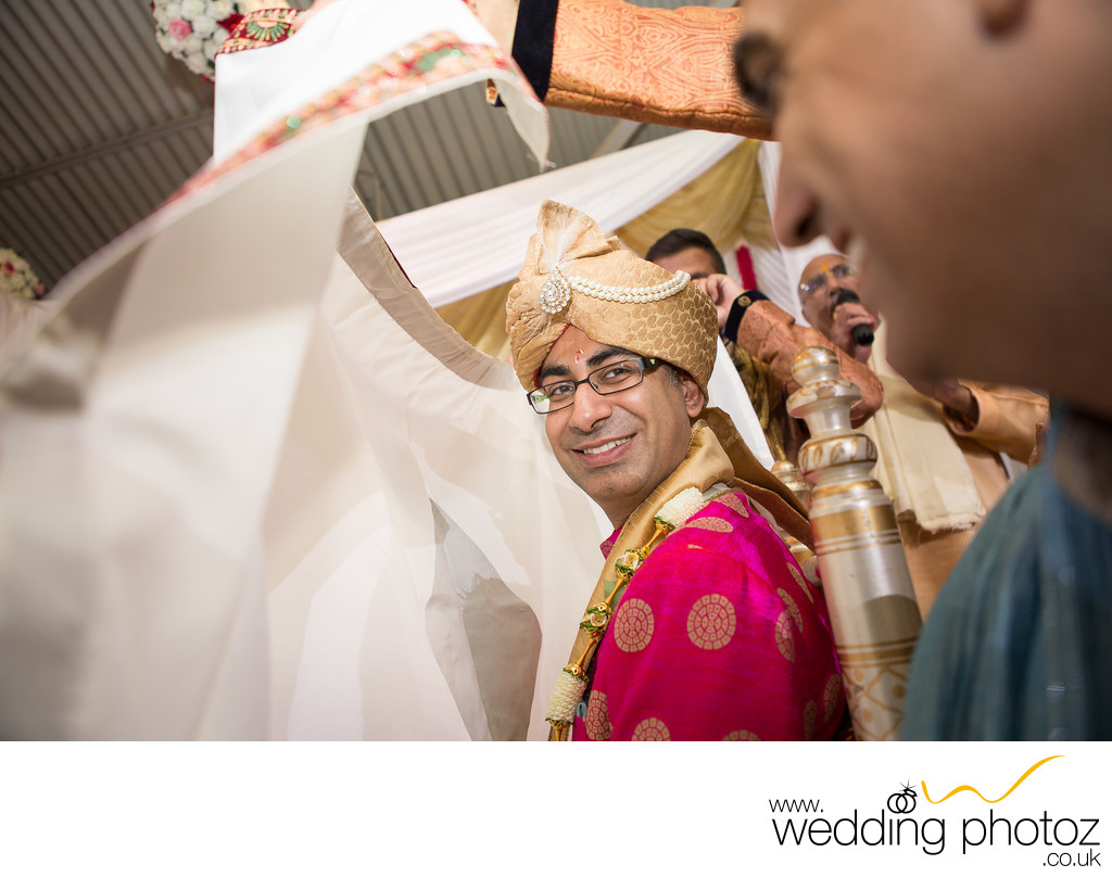 Indian Groom behind Antarpat at his traditional wedding