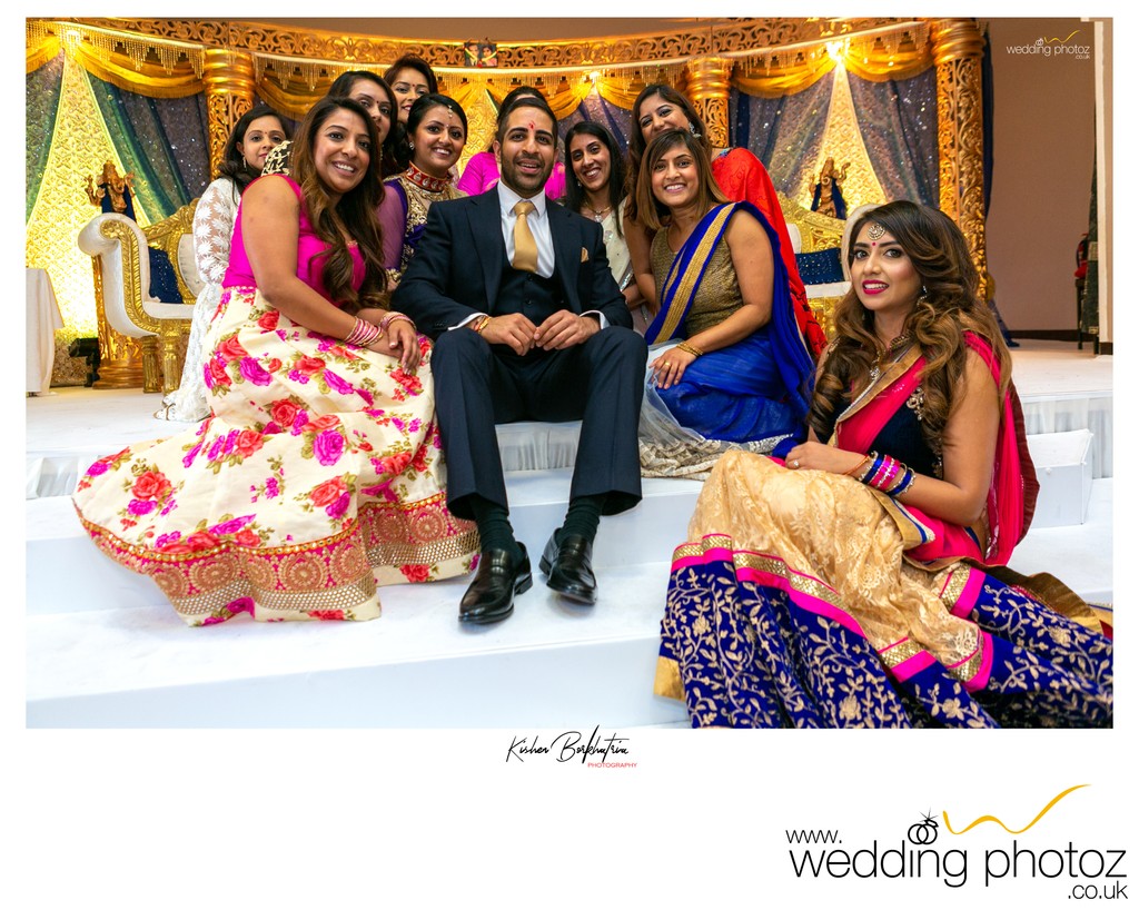 Groom surrounded by Indian Bridesmaids