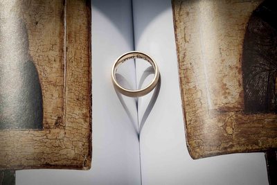 wedding ring band on book showing love symbol