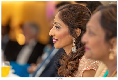 Bride at her Wedding Reception listening to Speech