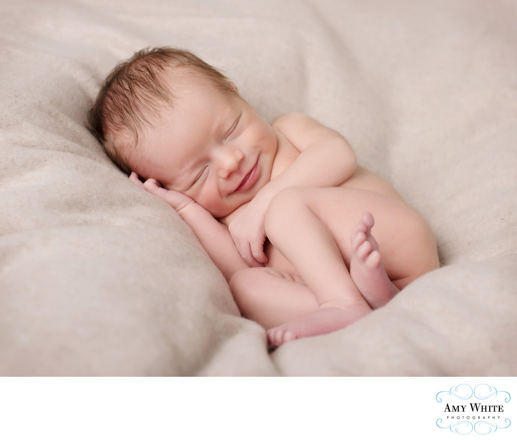 Newborn smiles during Cedar Rapids newborn photos