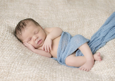 Sleepy Newborn Wrapped in Blue Cedar Rapids Photos