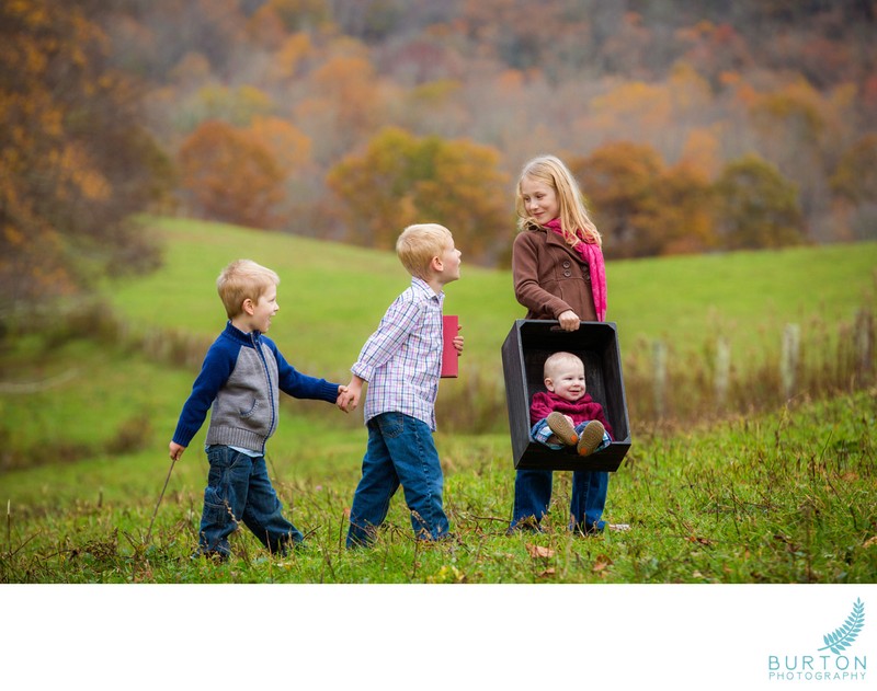 Siblings in mountain field, children’s portraits, Boone