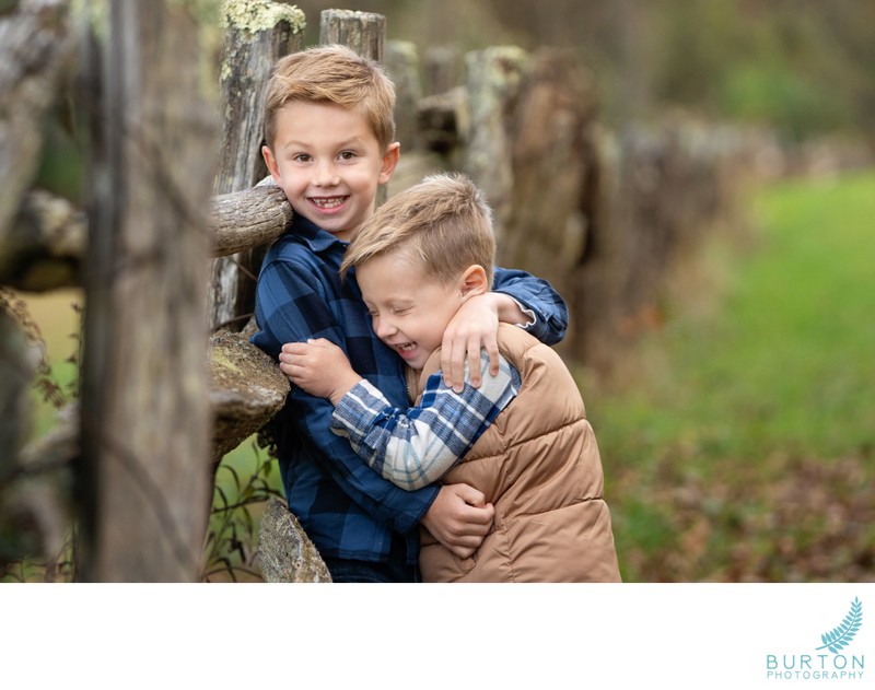 Brothers at rustic fence, children's portrait, Boone NC