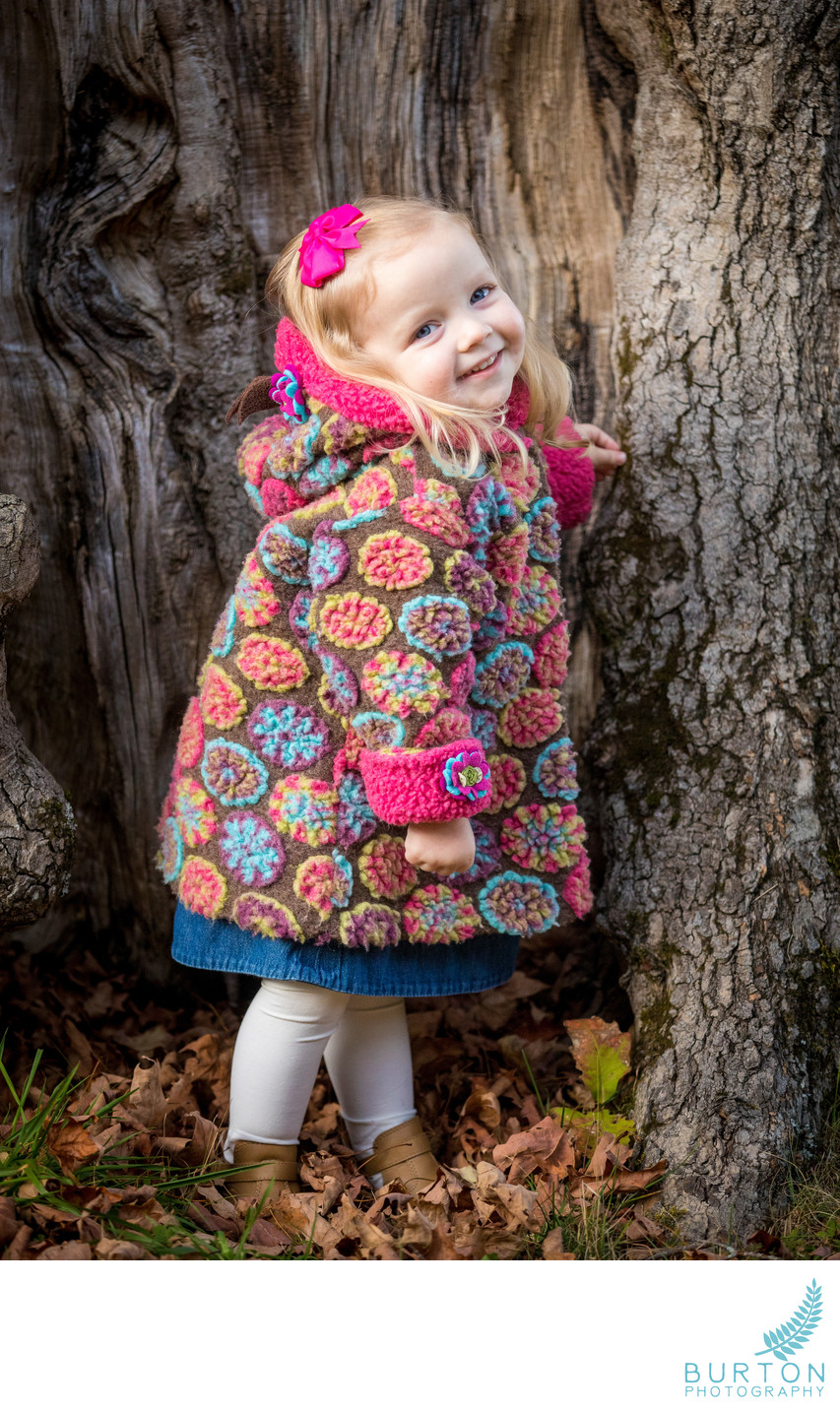 Winter Portrait of Girl in Whimsical Coat at Bass Lake