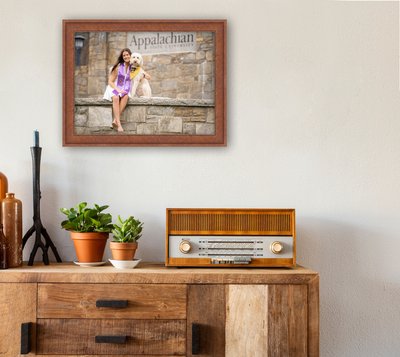 Retro living room design with cabinet and radio along with green plants and blank paintings, white wall