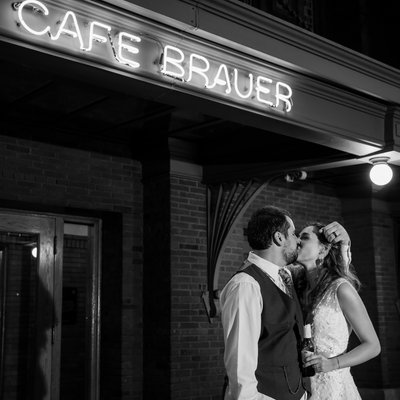 Night Time Portrait in front of Cafe Brauer Sign