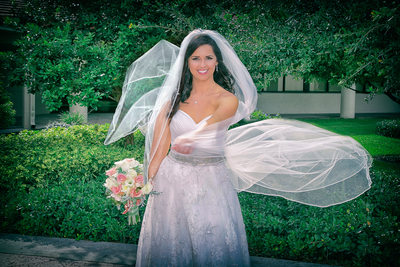 Bride having fun with her veil in Boca Raton.